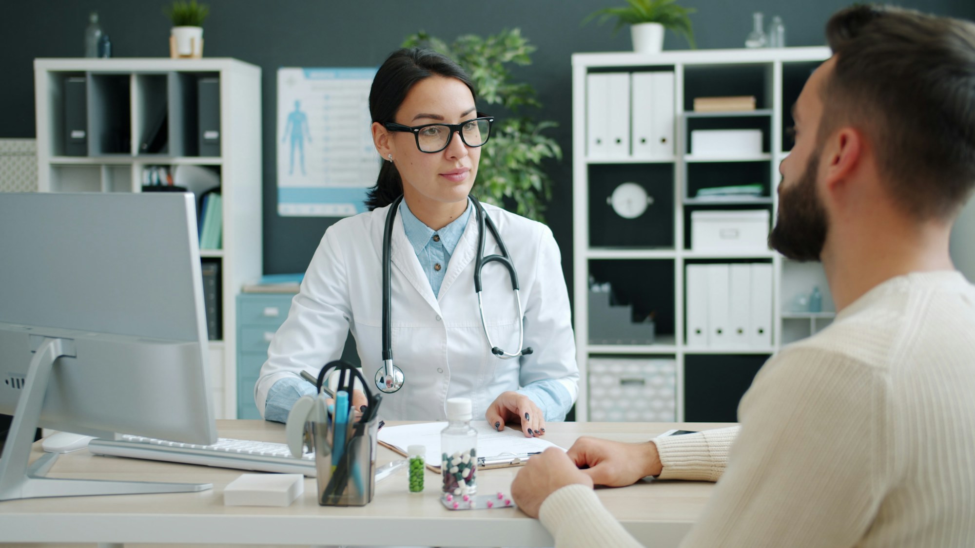 Clinician talking with a patient during an assessment appointment